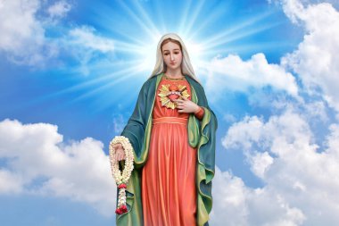 Our lady of grace virgin Mary with Bright Blue Sky and beautiful clouds with abstract colored background and wallpaper. clipart