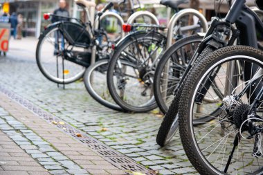 Urban streets with bikes. Bikes stay on Bicycle parking in Germany. clipart
