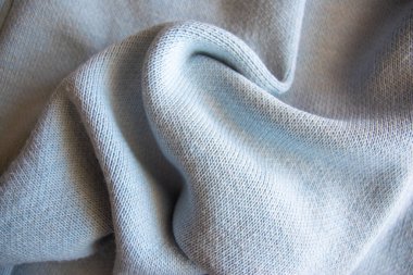 Mavi pamuklu yumuşak desenli giysiler. Tekstil kumaş arkaplanı.