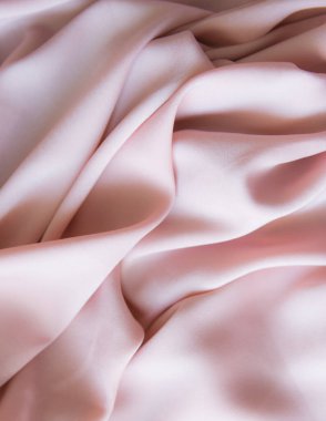 Pembe ipek, yumuşak desenli giysiler. Tekstil kumaş arkaplanı.