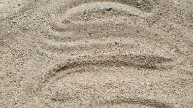 Wave on the sand near the water. Sea beach. Nature background. clipart