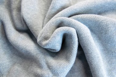 Mavi yün ve kaşmir yumuşak desenli giysiler. Moda kıyafetleri için kumaş örmek.