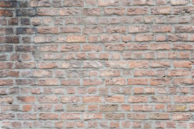 Eski binanın kahverengi yapısal taş duvarı tuğlalardan oluşur. Doğa yapısal arkaplan.