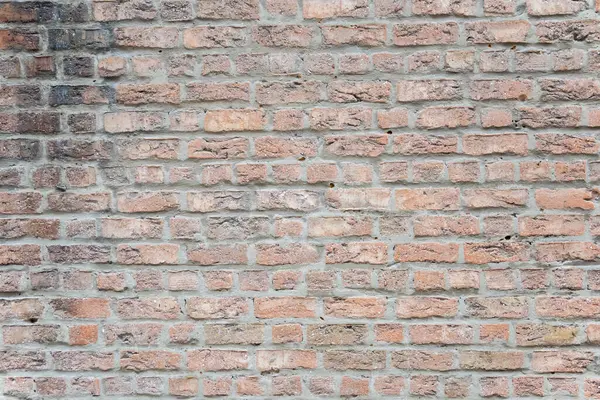 Eski binanın kahverengi yapısal taş duvarı tuğlalardan oluşur. Doğa yapısal arkaplan.