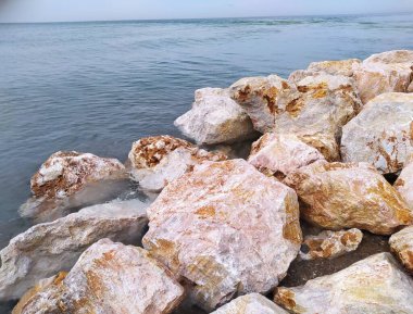 Big stones on the seashore clipart