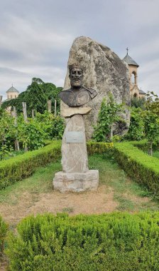 Bust of Heraclius II in the courtyard of the Trinity Cathedral, Tbilisi, Georgia clipart