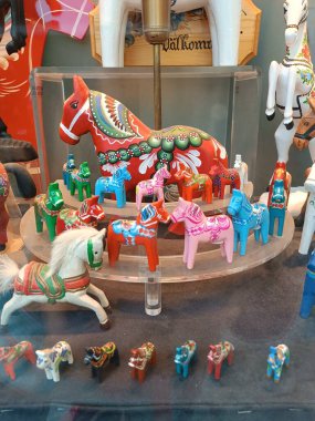 Swedish souvenir Dala Horse in a shop window in Stockholm. High quality photo clipart