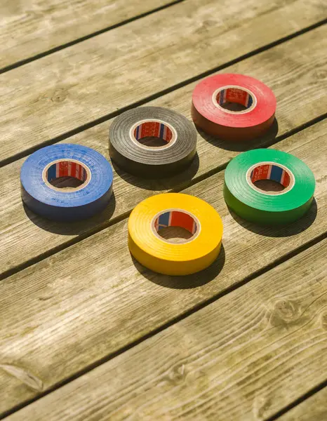 stock image Olympic rings from multicoloured tape on the wooden floor . High quality photo