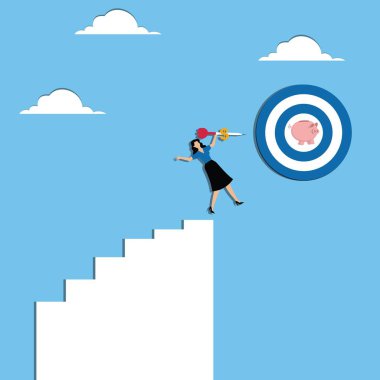 Kadın domuz kumbarasıyla dart tahtasına dart fırlatıyor.