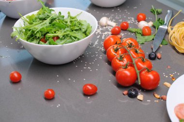 Fresh tomatoes in a plate on a dark background. Harvesting tomatoes. Top view. High quality photo clipart