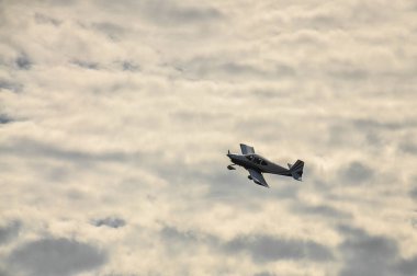 The airplane landing in front of a cloudy sky on a summer sunny evening. High quality photo clipart