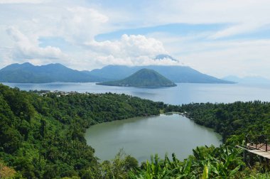 The original location of the image of the 1000 rupiah (Indonesian money) is located in Ternate. These are the islands of Tidore and Matiara with the expanse of sea and the slopes of Kampung Fitu. clipart
