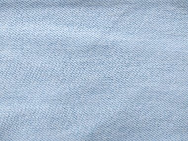 Denim kot kumaşı. Tasarım için Denim arkaplan dokusu. Kumaş kumaş. Arka plan olarak kullanılabilen mavi kot. Herhangi bir arkaplan için mavi kot dokusu