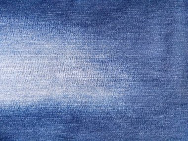 Denim kot kumaşı. Tasarım için Denim arkaplan dokusu. Kumaş kumaş. Arka plan olarak kullanılabilen mavi kot. Herhangi bir arkaplan için mavi kot dokusu