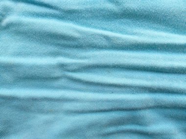 Denim kot kumaşı. Tasarım için Denim arkaplan dokusu. Kumaş kumaş. Arka plan olarak kullanılabilen mavi kot. Herhangi bir arkaplan için mavi kot dokusu