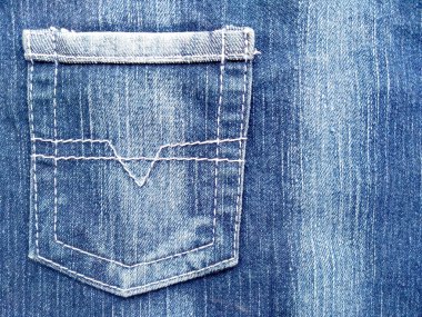 Denim kot kumaşı. Tasarım için Denim arkaplan dokusu. Kumaş kumaş. Arka plan olarak kullanılabilen mavi kot. Herhangi bir arkaplan için mavi kot dokusu