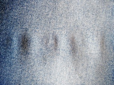 Denim kot kumaşı. Tasarım için Denim arkaplan dokusu. Kumaş kumaş. Arka plan olarak kullanılabilen mavi kot. Herhangi bir arkaplan için mavi kot dokusu
