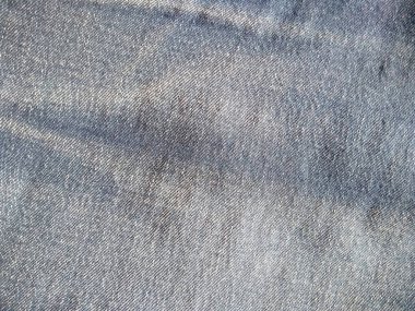 Denim kot kumaşı. Tasarım için Denim arkaplan dokusu. Kumaş kumaş. Arka plan olarak kullanılabilen mavi kot. Herhangi bir arkaplan için mavi kot dokusu