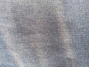 Denim kot kumaşı. Tasarım için Denim arkaplan dokusu. Kumaş kumaş. Arka plan olarak kullanılabilen mavi kot. Herhangi bir arkaplan için mavi kot dokusu