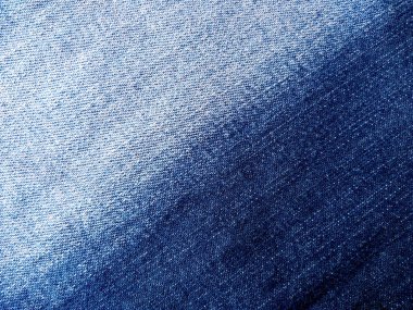 Denim kot kumaşı. Tasarım için Denim arkaplan dokusu. Kumaş kumaş. Arka plan olarak kullanılabilen mavi kot. Herhangi bir arkaplan için mavi kot dokusu