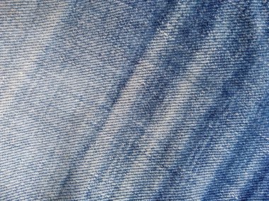 Denim kot kumaşı. Tasarım için Denim arkaplan dokusu. Kumaş kumaş. Arka plan olarak kullanılabilen mavi kot. Herhangi bir arkaplan için mavi kot dokusu