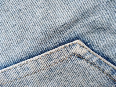 Denim kot kumaşı. Tasarım için Denim arkaplan dokusu. Kumaş kumaş. Arka plan olarak kullanılabilen mavi kot. Herhangi bir arkaplan için mavi kot dokusu