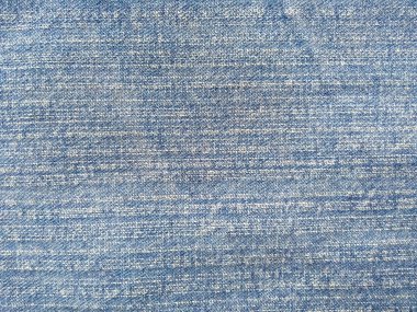 Denim kot kumaşı. Tasarım için Denim arkaplan dokusu. Kumaş kumaş. Arka plan olarak kullanılabilen mavi kot. Herhangi bir arkaplan için mavi kot dokusu