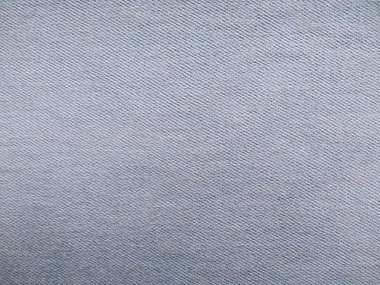 Denim kot kumaşı. Tasarım için Denim arkaplan dokusu. Kumaş kumaş. Arka plan olarak kullanılabilen mavi kot. Herhangi bir arkaplan için mavi kot dokusu