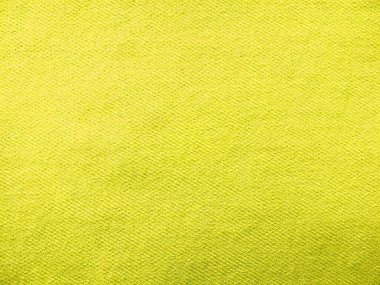 Denim kot kumaşı. Tasarım için Denim arkaplan dokusu. Kumaş kumaş. Arka plan olarak kullanılabilecek sarı bir kot. Herhangi bir arkaplan için sarı kot dokusu