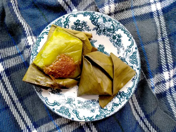 stock image Kue Pasung Bugis. Kue basah khas Bugis or Bugis specialty cakes. cake wrapped in banana leaves. traditional indonesian culinary food. Indonesian Street Food