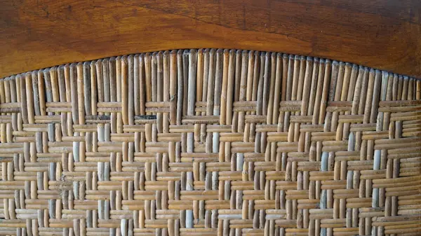 Rattan ağı düzgün bir desen oluşturur, mükemmel el işi, klasik arka plan dokuları için harika.