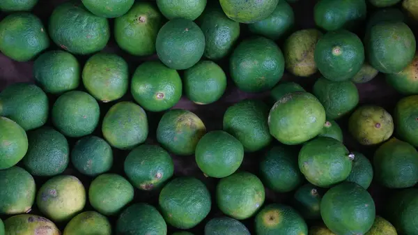 stock image Lime green in large quantities. Some are yellow