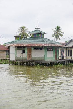 Mosque beside Martapura River Banjarmasin, South Kalimantan, Indonesia clipart