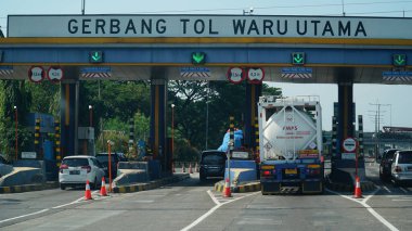 Waru Utama Toll Gate at noon clipart