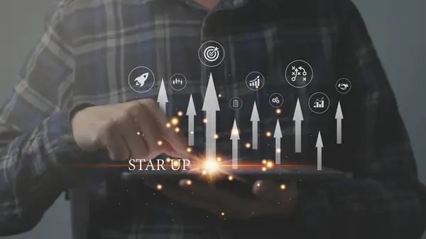 Startup concept with icon business and network connection on modern virtual interface from digital tablet. man touching on tablet.