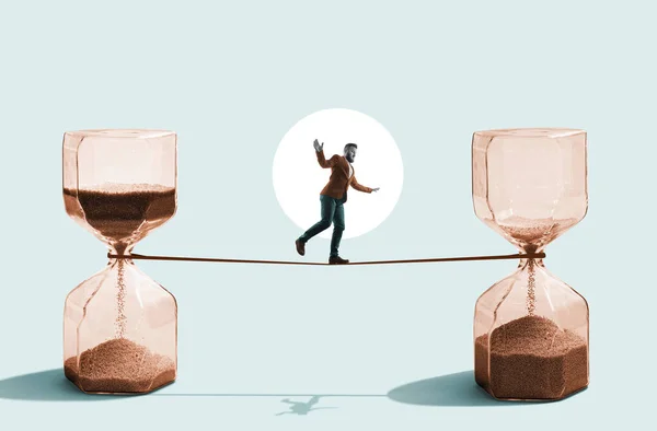 A man balances on a tightrope between an hourglass. Art collage.