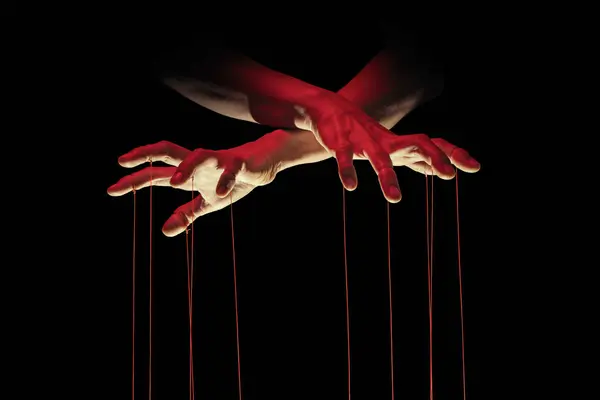 stock image Puppeteer's hands with strings on each finger on black background.