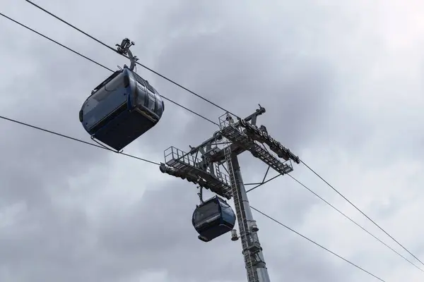 stock image yellow cable car means of transport with a view of the city of bolivia and el alto in a sunset with blue sky and clouds with natural light