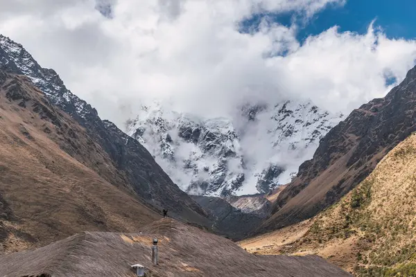 stock image humantay lagoon in the andes mountain range of peru cusco surrounded by snow capped mountains with clouds