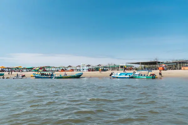 stock image blue boat tip in the mangroves of tumbes at low tide on a sunny day and blue sky surrounded by trees