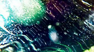 Camdan suyla parçacıkları gösteren soyut canlandırılmış arkaplan.