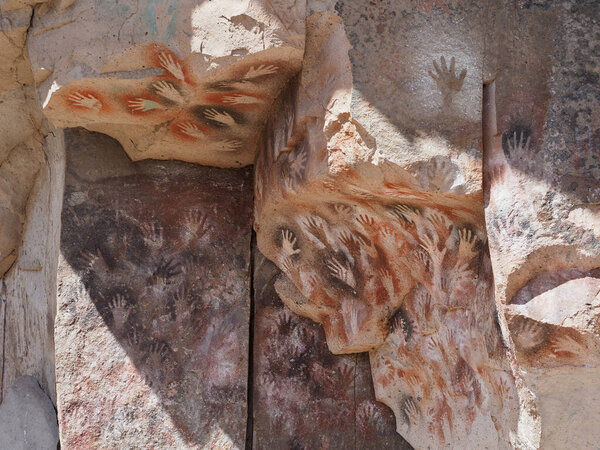 Cueva de los Manos or Cave of the Hands in Patagonia. It is a cave and complex of rock art sites in the province of Santa Cruz, Argentina. The cave is named for the hundreds of paintings of hands.