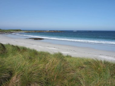 Beach. Isle of Tiree. Scotland. The Isle of Tiree is the most westerly island of the Inner Hebrides. Tiree is known for its beautiful white sand beaches and is popular for surfing and windsurfing. clipart