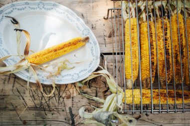 grilled corn on a table  clipart