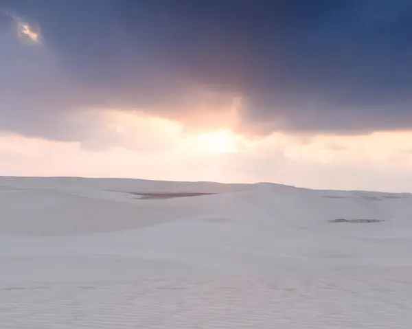 stock image Sunrise over the tranquil Zahek Dunes in Socotra, Yemen, with soft light illuminating the sand.