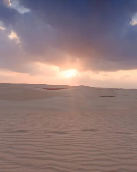 stock image Sunrise over the tranquil Zahek Dunes in Socotra, Yemen, with soft light illuminating the sand.