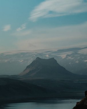 Moody mountain and glacier landscape at dawn in South Iceland. clipart