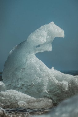 Close-up of an intricately shaped iceberg at Jokulsarlon, South Iceland. clipart