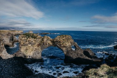 Gatklettur, the natural stone arch at Arnarstapi, Snaefellsnes Peninsula, West Iceland clipart