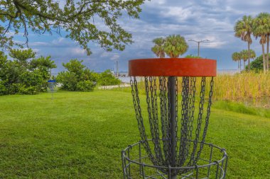 A Frisbee Golf Net at Picnic Island Park City of Tampa Bay Florida USA. The locations near MacDill Air Force Base and Tampa International Airport. This beachfront location has spectacular views free parking a boat ramp and fishing pier. clipart